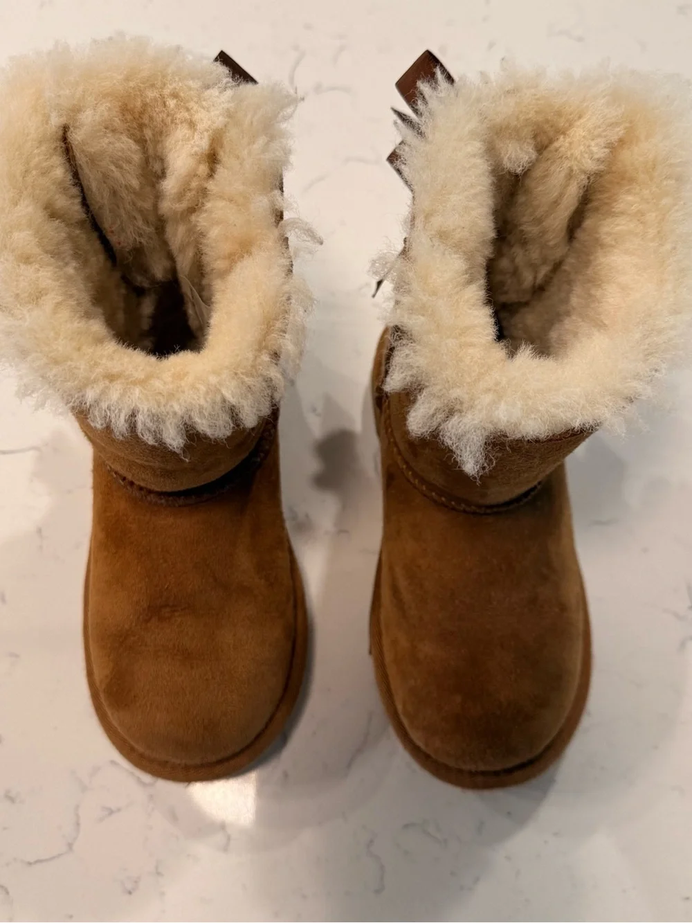UGG Kids Cozy Faux-Shearling Brown Boots with Bows